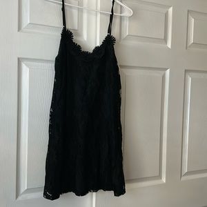 Black spaghetti strap mini dress. Lacr with black lining size medium